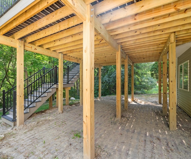 2418 Meadowridge Ct, Ann Arbor, MI 48105 - view of patio featuring stairway and a carport