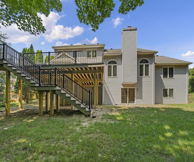 2418 Meadowridge Ct, Ann Arbor, MI 48105 - back of house featuring stairway, a wooden deck, a lawn, and a chimney