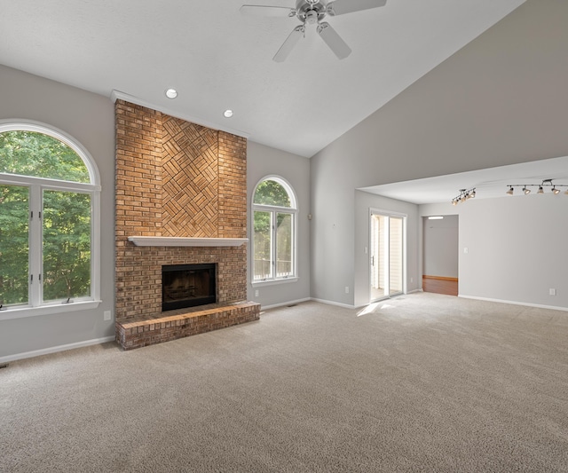 2418 Meadowridge Ct, Ann Arbor, MI 48105 - unfurnished living room with ceiling fan, carpet flooring, a brick fireplace, high vaulted ceiling, and recessed lighting