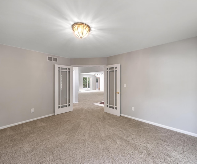 2418 Meadowridge Ct, Ann Arbor, MI 48105 - carpeted spare room with french doors
