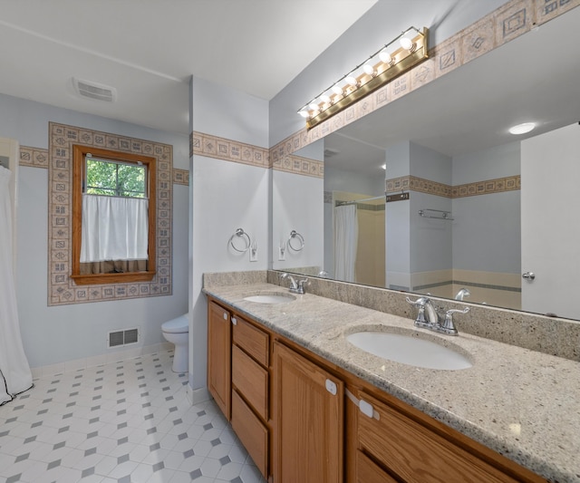 2418 Meadowridge Ct, Ann Arbor, MI 48105 - bathroom featuring double vanity, curtained shower, and tile patterned floors