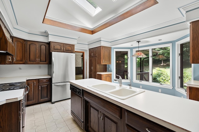 1130 W G Ave, Kalamazoo, MI 49009 - kitchen featuring freestanding refrigerator, black dishwasher, a tray ceiling, a skylight, and light countertops