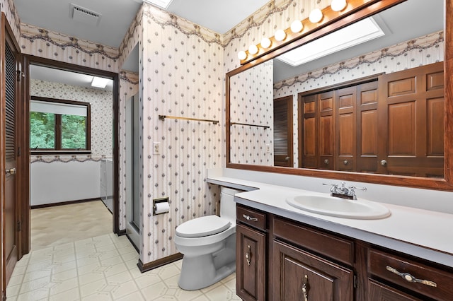 1130 W G Ave, Kalamazoo, MI 49009 - bathroom with wallpapered walls, vanity, and tile patterned floors