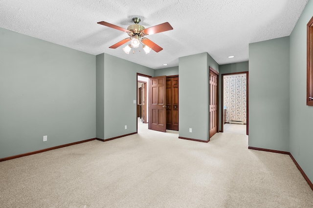 1130 W G Ave, Kalamazoo, MI 49009 - unfurnished bedroom with carpet floors, a textured ceiling, recessed lighting, ceiling fan, and connected bathroom