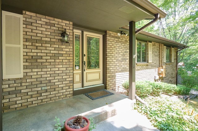 1130 W G Ave, Kalamazoo, MI 49009 - view of exterior entry featuring brick siding and a porch