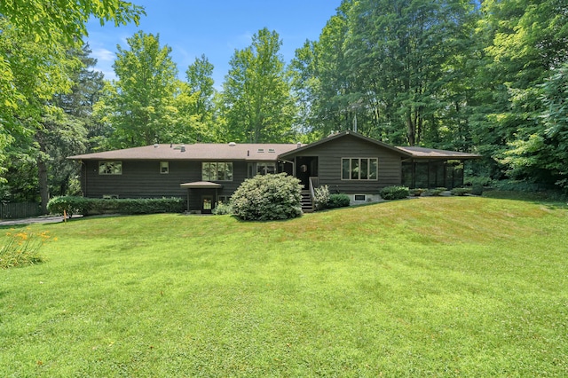 1130 W G Ave, Kalamazoo, MI 49009 - back of house with a sunroom and a yard