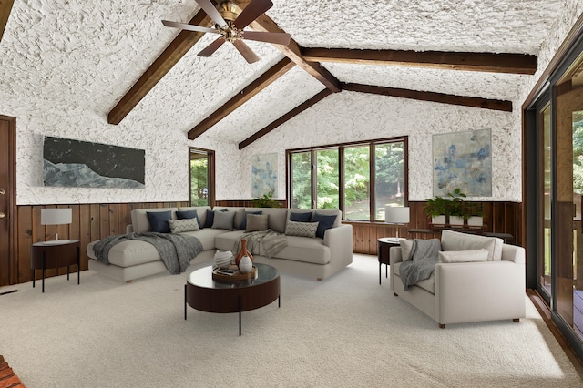 1130 W G Ave, Kalamazoo, MI 49009 - living area with a wainscoted wall, beamed ceiling, a ceiling fan, carpet, and wooden walls