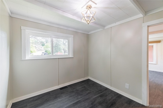 8614 Lake Rd, Grosse Ile, MI 48138 - spare room featuring dark wood-style flooring and a chandelier