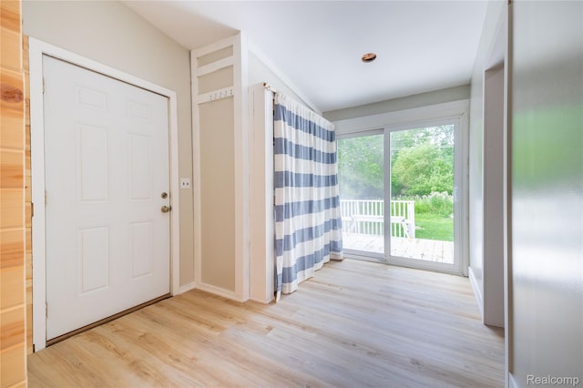 8614 Lake Rd, Grosse Ile, MI 48138 - foyer entrance featuring wood finished floors and baseboards