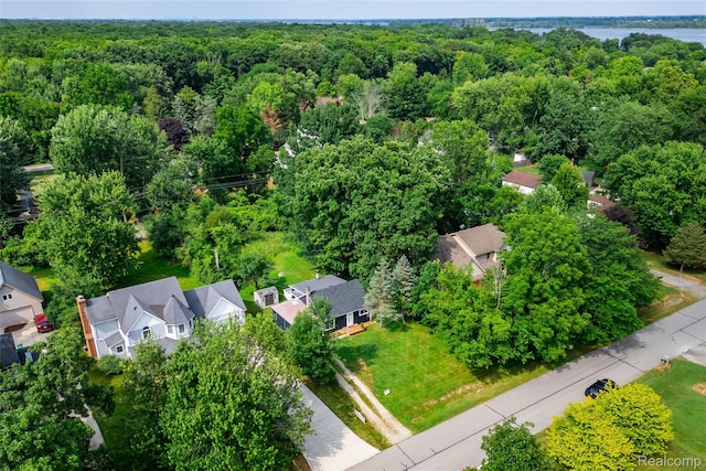 8614 Lake Rd, Grosse Ile, MI 48138 - aerial perspective of suburban area featuring a heavily wooded area
