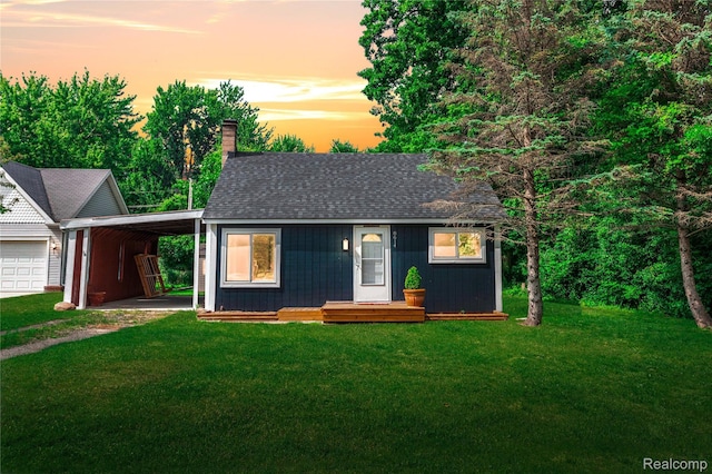 8614 Lake Rd, Grosse Ile, MI 48138 - view of front of property featuring an attached carport, an outdoor structure, a chimney, and a front lawn