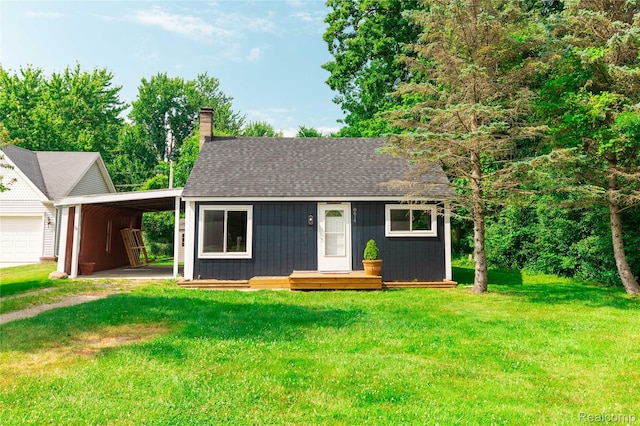 8614 Lake Rd, Grosse Ile, MI 48138 - view of front of property with an outdoor structure, a chimney, a carport, and a front yard