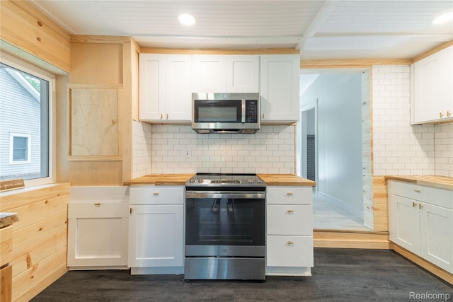8614 Lake Rd, Grosse Ile, MI 48138 - kitchen with butcher block counters, stainless steel appliances, dark wood-style floors, decorative backsplash, and recessed lighting