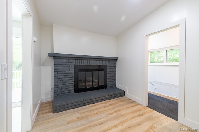 8614 Lake Rd, Grosse Ile, MI 48138 - detailed view of wood finished floors and a fireplace