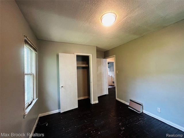 22510 Frisbee St, Detroit, MI 48219 - unfurnished bedroom with a textured ceiling, wood finished floors, and a closet