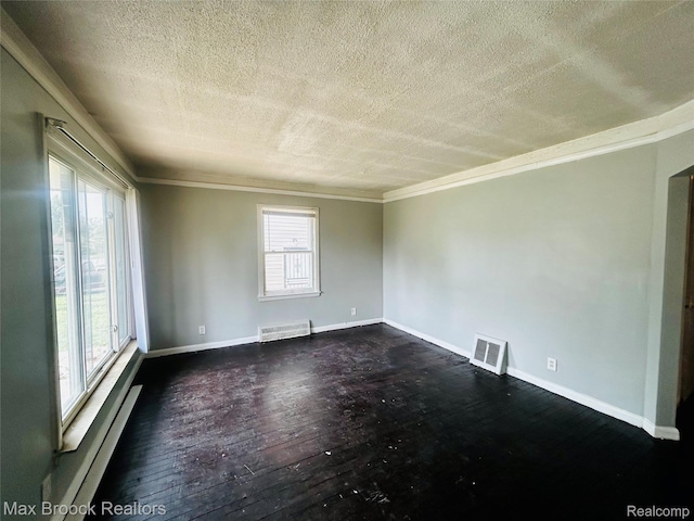 22510 Frisbee St, Detroit, MI 48219 - spare room featuring a textured ceiling, ornamental molding, dark wood finished floors, and a baseboard heating unit