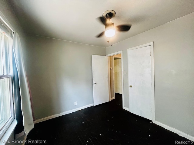 22510 Frisbee St, Detroit, MI 48219 - unfurnished bedroom with dark wood-type flooring and a ceiling fan