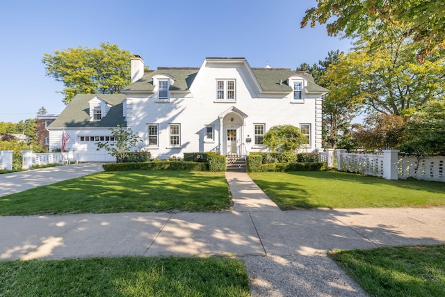 106 Rust Ave, Big Rapids, MI 49307 - view of front of house featuring a chimney and driveway