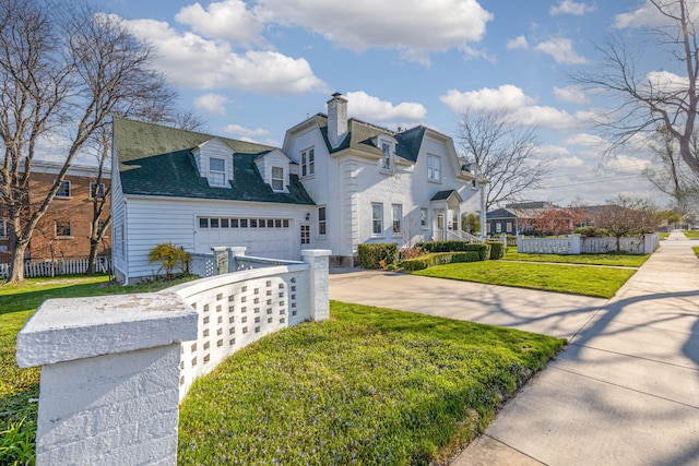 106 Rust Ave, Big Rapids, MI 49307 - view of front of home with driveway, a chimney, and a shingled roof