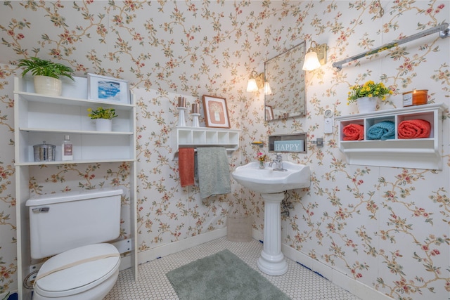106 Rust Ave, Big Rapids, MI 49307 - half bathroom with tile patterned flooring and wallpapered walls