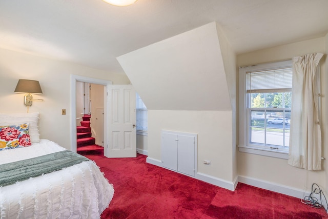 106 Rust Ave, Big Rapids, MI 49307 - bedroom featuring dark carpet and lofted ceiling