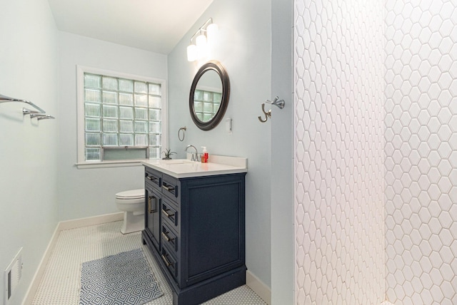 2659 Bedford Rd, Ann Arbor, MI 48104 - full bathroom with vanity, tiled shower, and tile patterned flooring