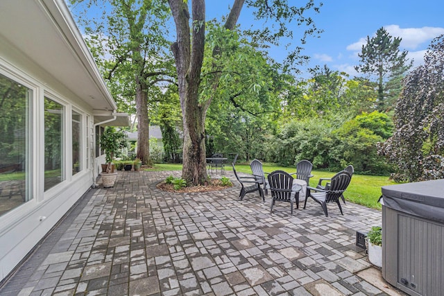 2659 Bedford Rd, Ann Arbor, MI 48104 - view of patio featuring a hot tub and view of scattered trees