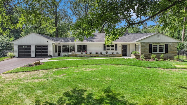 2659 Bedford Rd, Ann Arbor, MI 48104 - ranch-style house featuring driveway, stone siding, and a garage