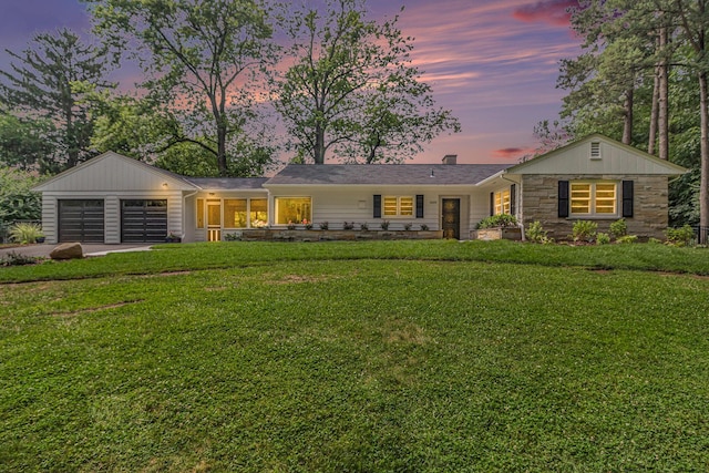 2659 Bedford Rd, Ann Arbor, MI 48104 - single story home featuring a garage, a yard, concrete driveway, and stone siding