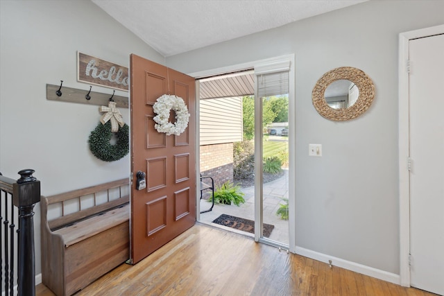1393 Shankin Dr, Walled Lake, MI 48390 - entrance foyer featuring light wood-style floors and vaulted ceiling
