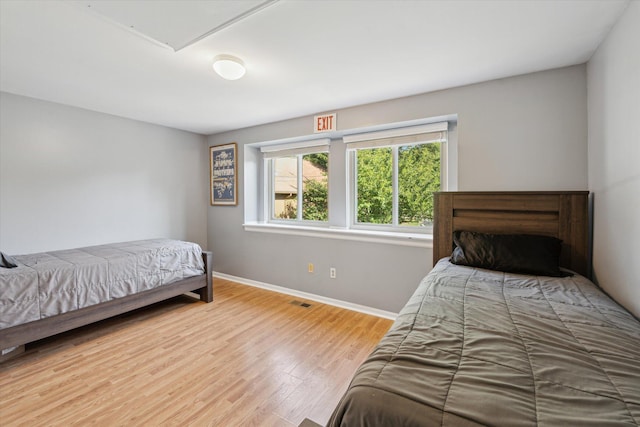 1393 Shankin Dr, Walled Lake, MI 48390 - bedroom featuring wood finished floors and baseboards