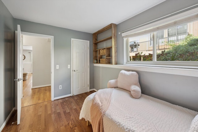 1393 Shankin Dr, Walled Lake, MI 48390 - bedroom with wood finished floors and baseboards
