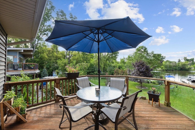 1393 Shankin Dr, Walled Lake, MI 48390 - deck featuring outdoor dining space, a water view, and a lawn