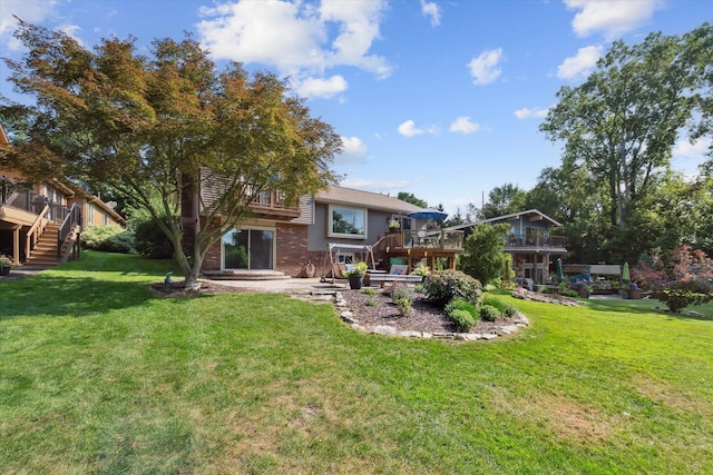 1393 Shankin Dr, Walled Lake, MI 48390 - rear view of property with stairway, a deck, a lawn, and a patio