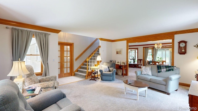 3733 N Hoover Ave, Gladwin, MI 48624 - living room with stairs, french doors, a chandelier, carpet floors, and crown molding