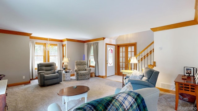 3733 N Hoover Ave, Gladwin, MI 48624 - living room with ornamental molding, carpet floors, stairway, a chandelier, and french doors