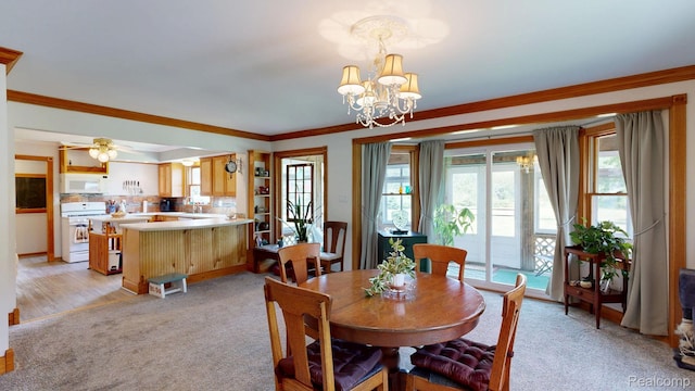 3733 N Hoover Ave, Gladwin, MI 48624 - dining room featuring light carpet, a chandelier, and ornamental molding