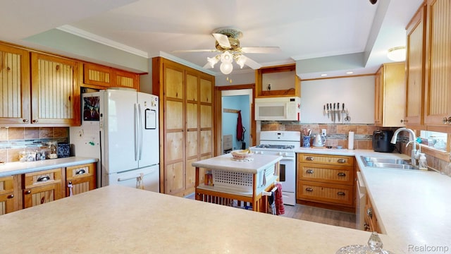 3733 N Hoover Ave, Gladwin, MI 48624 - kitchen with white appliances, light countertops, a ceiling fan, ornamental molding, and recessed lighting