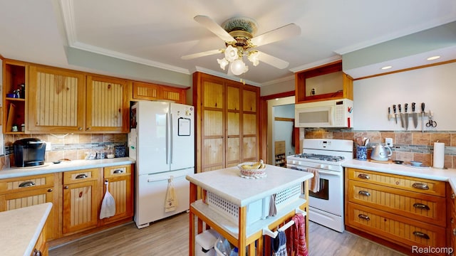 3733 N Hoover Ave, Gladwin, MI 48624 - kitchen with white appliances, open shelves, light countertops, backsplash, and a ceiling fan