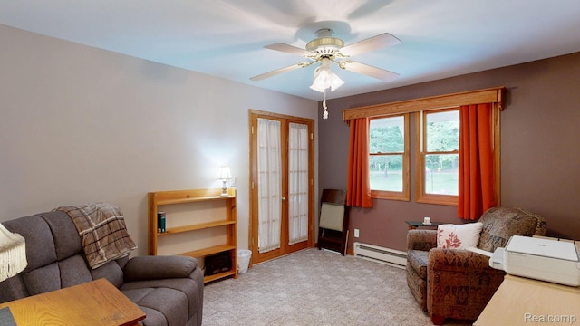 3733 N Hoover Ave, Gladwin, MI 48624 - carpeted living room with baseboard heating and a ceiling fan
