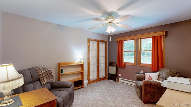 3733 N Hoover Ave, Gladwin, MI 48624 - living area with a baseboard radiator, carpet, and a ceiling fan