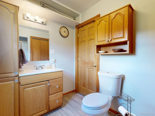 3733 N Hoover Ave, Gladwin, MI 48624 - bathroom with vanity and wood finished floors