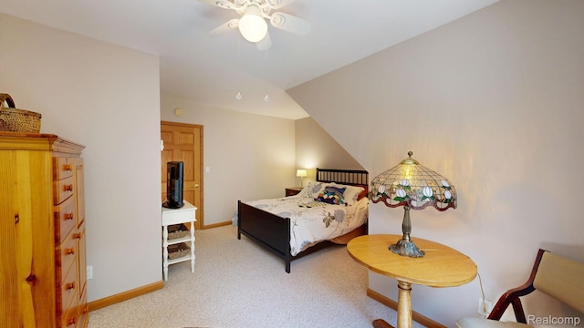 3733 N Hoover Ave, Gladwin, MI 48624 - bedroom with light carpet and ceiling fan