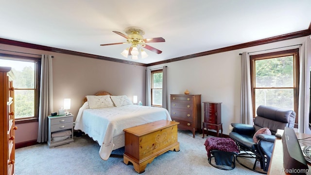 3733 N Hoover Ave, Gladwin, MI 48624 - bedroom with light colored carpet, ornamental molding, and ceiling fan
