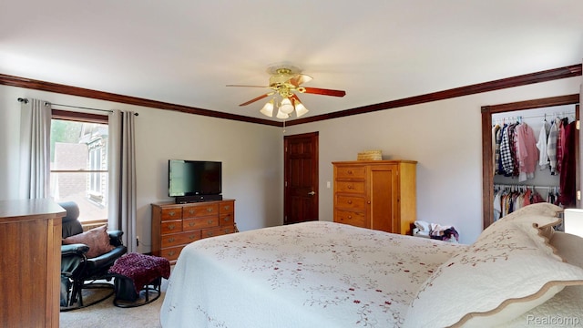 3733 N Hoover Ave, Gladwin, MI 48624 - bedroom with carpet floors, ornamental molding, ceiling fan, and a closet