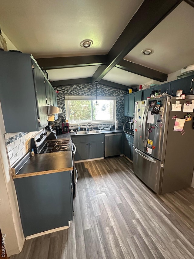 5076 Spring Well Ln, Grand Blanc, MI 48439 - kitchen featuring stainless steel appliances, dark wood-style floors, tasteful backsplash, dark countertops, and ventilation hood