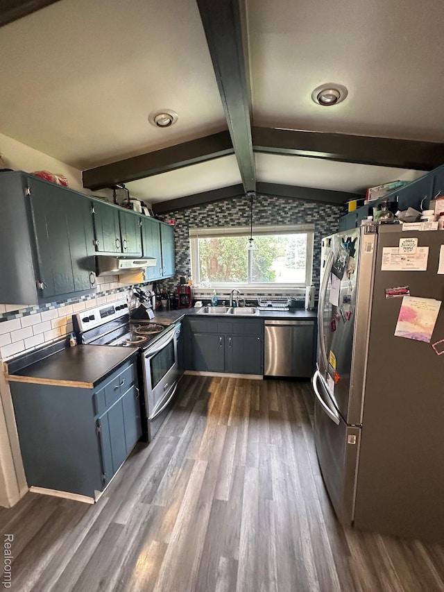 5076 Spring Well Ln, Grand Blanc, MI 48439 - kitchen featuring appliances with stainless steel finishes, dark wood-style flooring, dark countertops, and tasteful backsplash