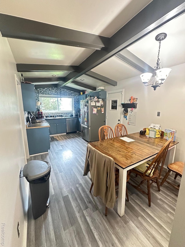 5076 Spring Well Ln, Grand Blanc, MI 48439 - dining area with wood finished floors and a chandelier