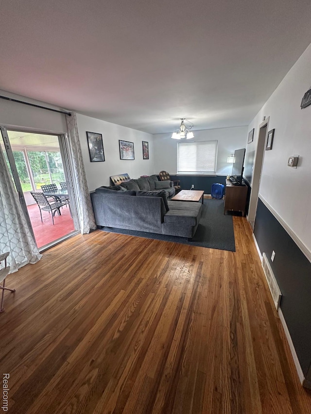 5076 Spring Well Ln, Grand Blanc, MI 48439 - living room with wood finished floors and a chandelier