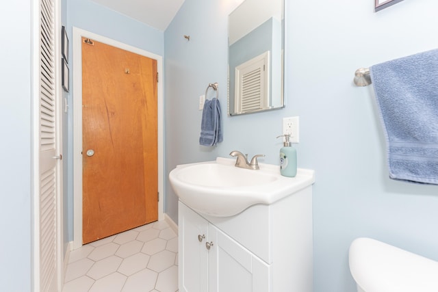2100 Alice St, Ann Arbor, MI 48103 - bathroom featuring vanity, a closet, and tile patterned floors